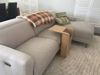 Picture of Side Table next to  bed slotted over the seat of a sofa Ideal for small rooms