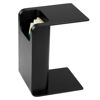 Picture of Black Side Table next to  bed slotted over the seat of a sofa otis side table